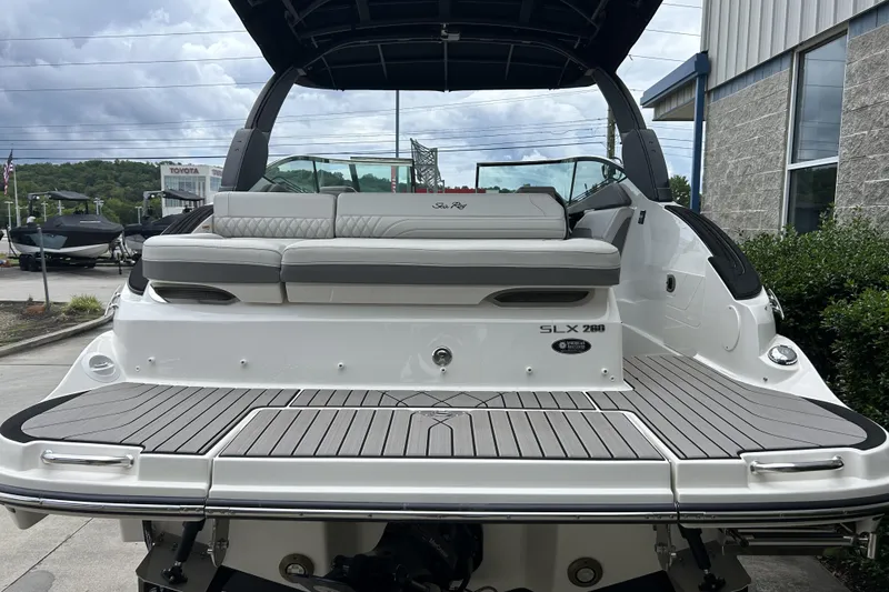 Slide: The Image of 2023 Sea Ray SLX 260 boat with sleek design and spacious seating. - 6