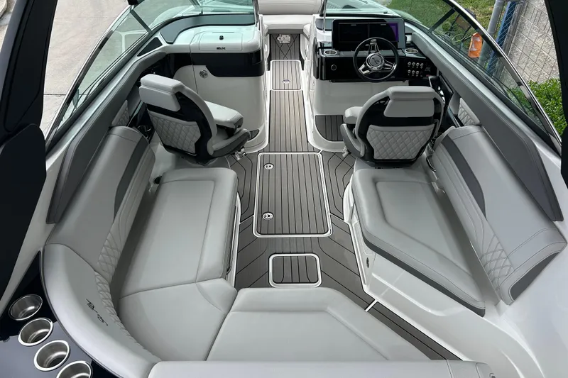 Slide: The Image of Luxurious interior of 2023 Sea Ray SLX 260 boat with modern seating and sleek design. - 9