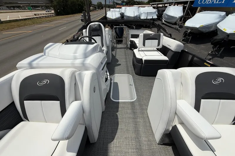 Slide: The Image of 2024 Barletta CORSA 23QSS pontoon boat interior with luxurious seating and modern design. - 10