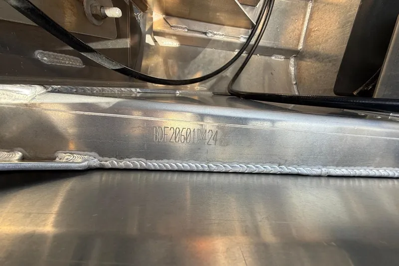 Slide: The Image of 2024 Barletta CORSA 23QSS boat hull with visible serial number and welds. - 17