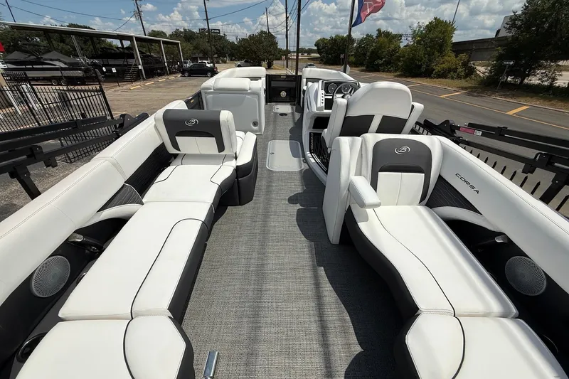 Slide: The Image of 2024 Barletta CORSA 23QSS pontoon boat interior with luxurious seating and modern design. - 7