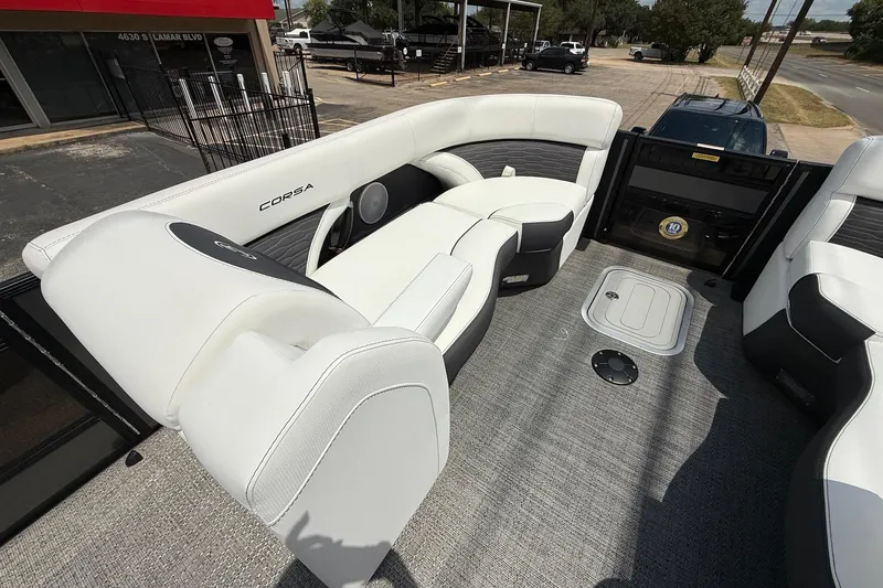 Slide: The Image of 2024 Barletta CORSA 23QSS boat interior with white seating and modern design. - 8
