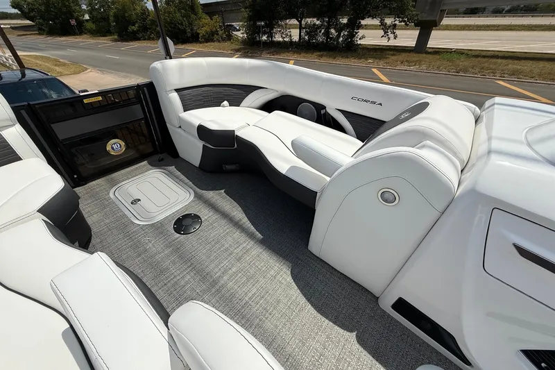 Slide: The Image of 2024 Barletta CORSA 23QSS boat interior with white seating and modern design. - 9