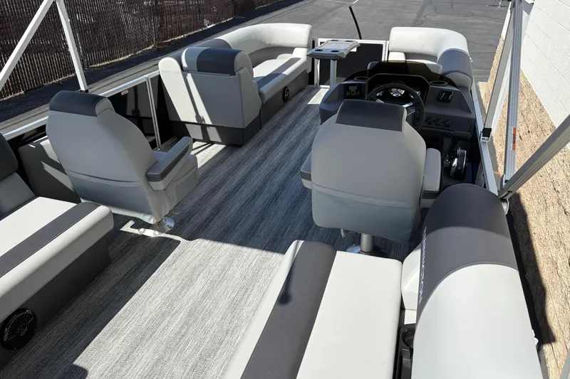 Slide: The Image of 2026 Bennington 21 SSR pontoon boat interior with gray seating and modern helm. - 4