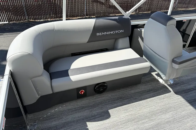 Slide: The Image of 2026 Bennington 21 SSR boat interior with gray seating and modern design. - 5