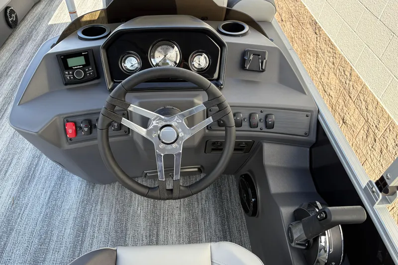 Slide: The Image of 2026 Bennington 21 SSR boat dashboard with steering wheel and control panel. - 8