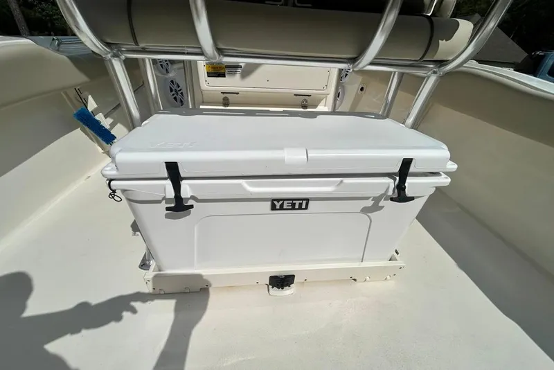 Slide: The Image of YETI cooler on 2022 Key West 219 FS boat deck, with stainless steel railings. - 14