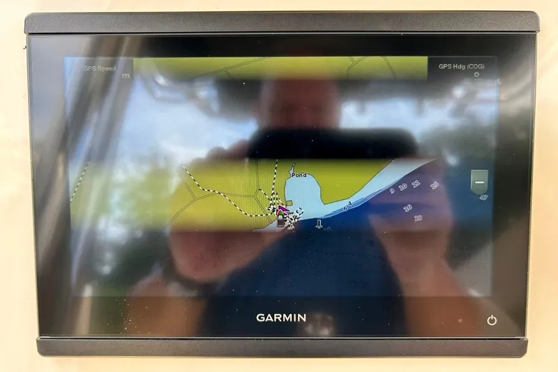 Slide: The Image of Garmin GPS display on 2022 Key West 219 FS boat, showing navigation map. - 20