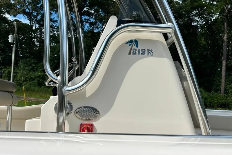Slide: The Image of 2022 Key West 219 FS boat console with stainless steel rails and logo. - 25