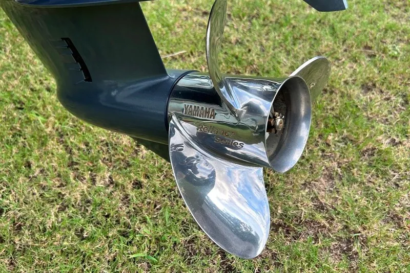 Slide: The Image of Yamaha Reliance Series propeller on Key West 219 FS, 2022 model, displayed on grass. - 26