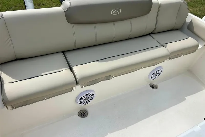 Slide: The Image of 2022 Key West 219 FS boat with cushioned seating and built-in speakers. - 28