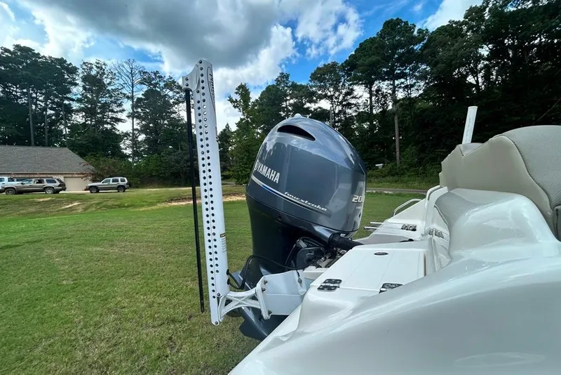 Slide: The Image of 2022 Key West 219 FS boat with Yamaha outboard motor in a grassy area. - 3