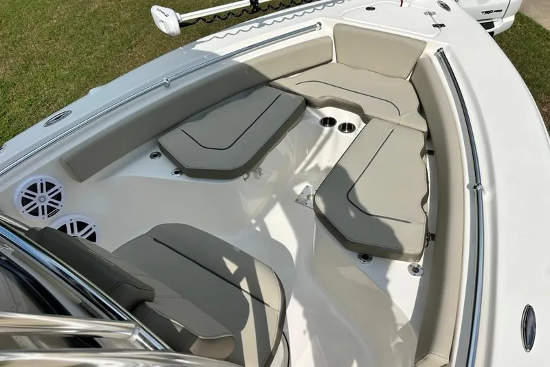 Slide: The Image of 2022 Key West 219 FS boat interior with cushioned seating and cup holders. - 31