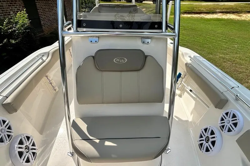 Slide: The Image of 2022 Key West 219 FS boat interior with cushioned seating and speakers. - 32