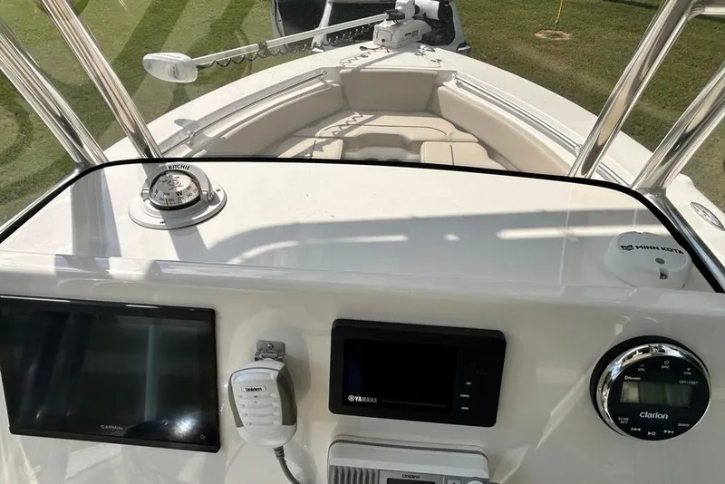 Slide: The Image of 2022 Key West 219 FS boat dashboard with navigation and control systems. - 38
