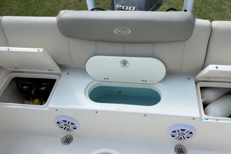 Slide: The Image of 2022 Key West 219 FS boat interior with storage compartments and seating. - 41