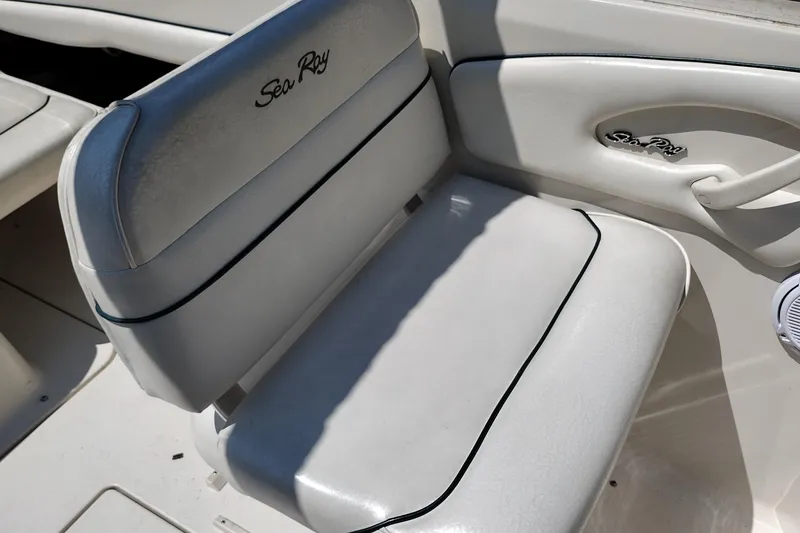 Slide: The Image of White leather seat on 1999 Sea Ray 215 Express Cruiser boat. - 19