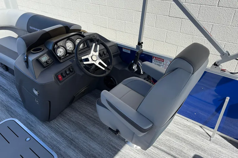Slide: The Image of 2026 Bennington 21 SSB boat cockpit with steering wheel and control panel. - 6