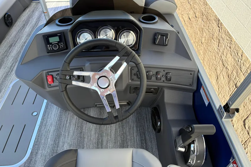 Slide: The Image of 2026 Bennington 21 SSB boat dashboard with steering wheel and control panel. - 7