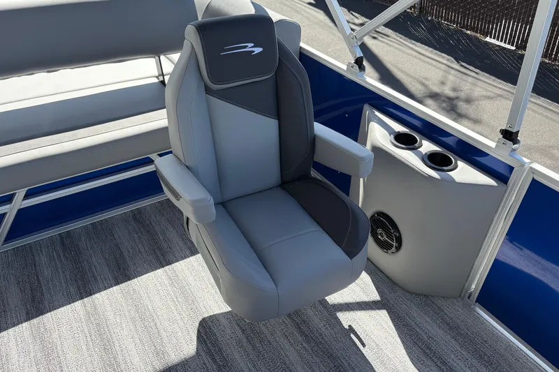 Slide: The Image of Captain's chair on 2026 Bennington 21 SSB pontoon boat, featuring cup holders and speaker. - 9