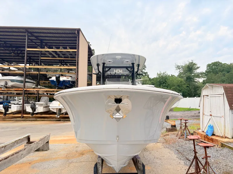 Slide: The Image of 2022 Sportsman 241 Heritage boat in storage yard, front view. - 11