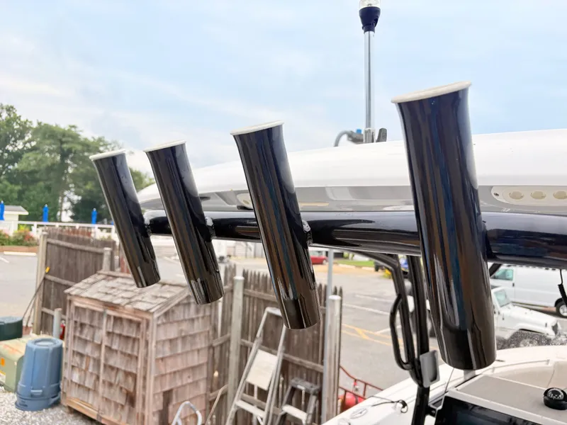 Slide: The Image of Rod holders on a 2022 Sportsman 241 Heritage boat, dockside view. - 23