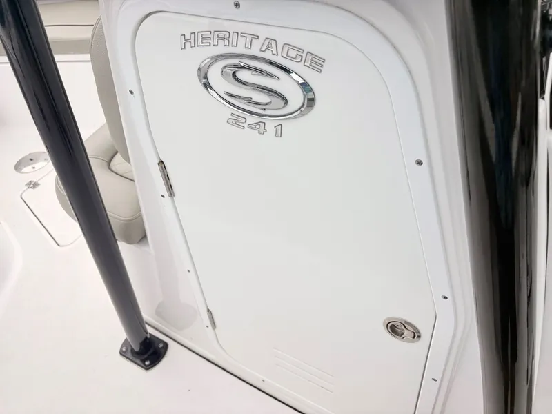 Slide: The Image of 2022 Sportsman 241 Heritage boat console with logo and seating detail. - 26