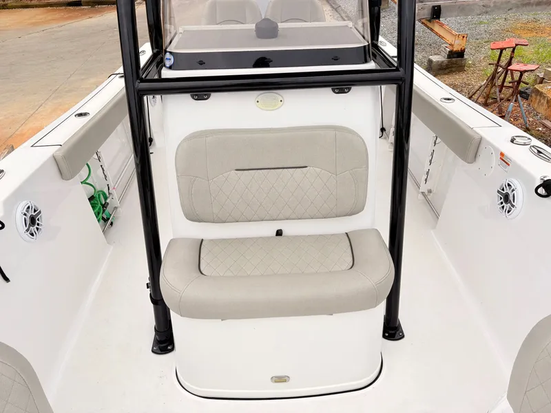 Slide: The Image of 2022 Sportsman 241 Heritage boat interior with cushioned seating and modern design. - 35