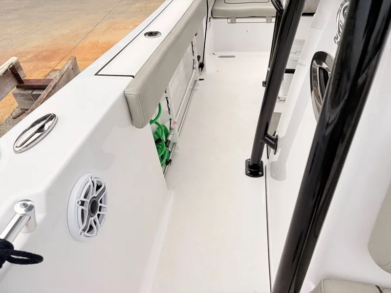 Slide: The Image of 2022 Sportsman 241 Heritage boat interior with seating, rod holders, and speaker. - 38