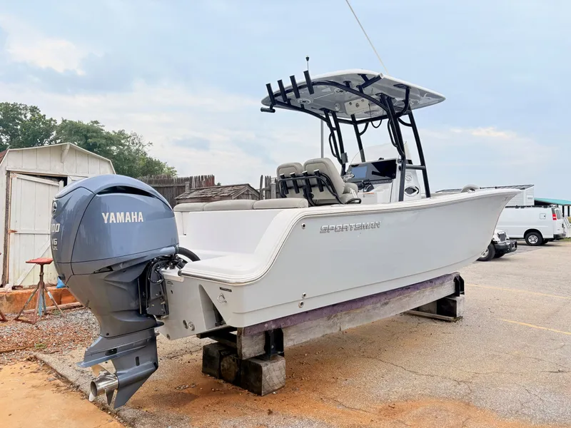 Slide: The Image of 2022 Sportsman 241 Heritage boat with Yamaha engine on display outdoors. - 4