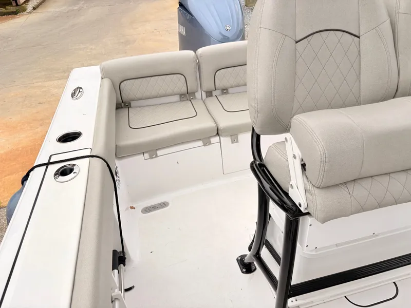 Slide: The Image of 2022 Sportsman 241 Heritage boat interior with cushioned seating and sleek design. - 40