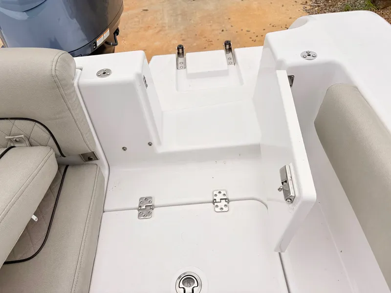 Slide: The Image of 2022 Sportsman 241 Heritage boat interior with cushioned seating and storage compartments. - 43