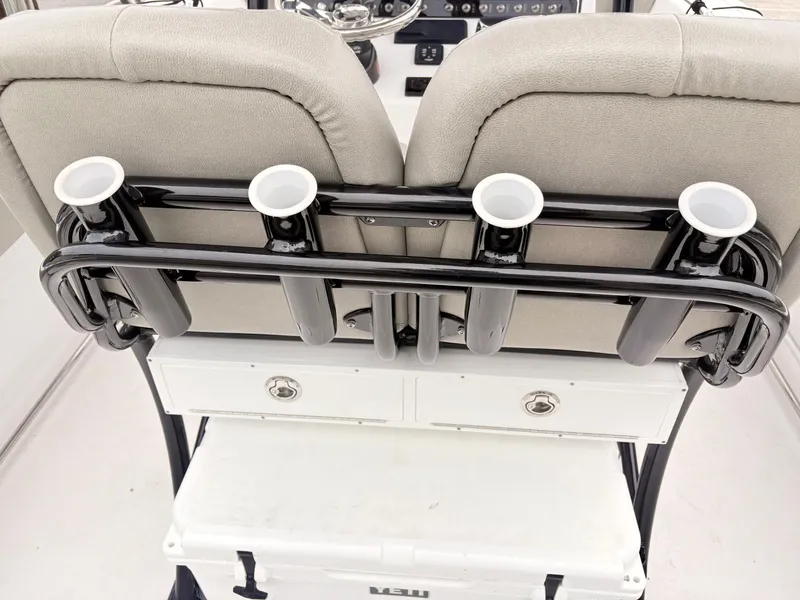 Slide: The Image of 2022 Sportsman 241 Heritage boat seating with rod holders and storage compartments. - 47