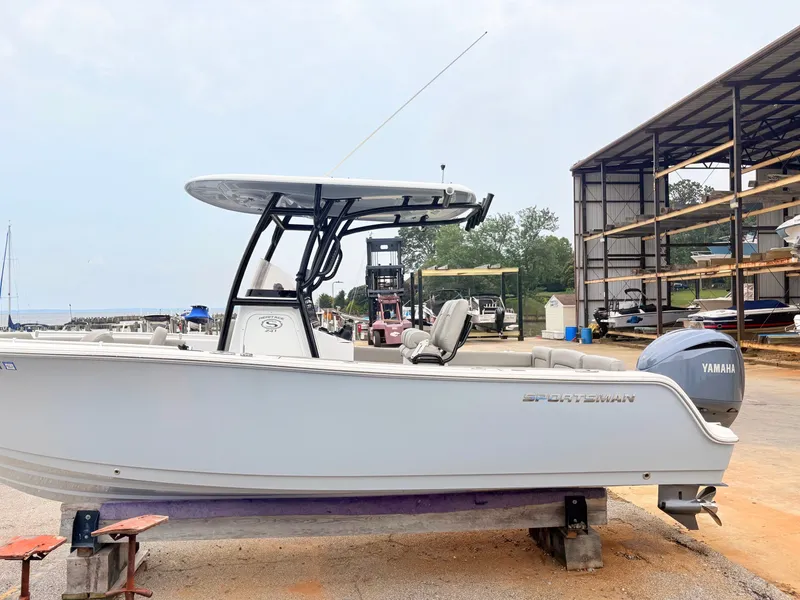 Slide: The Image of 2022 Sportsman 241 Heritage boat with Yamaha engine, docked at marina. - 9