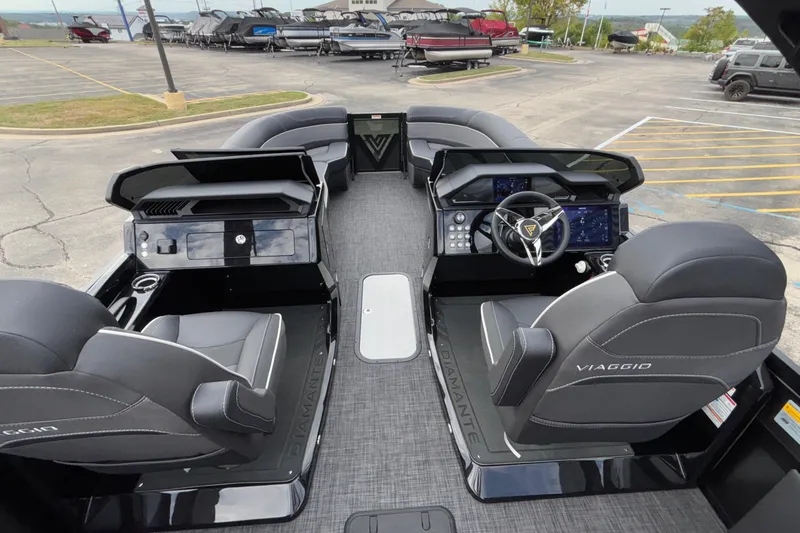 Slide: The Image of Interior of 2026 Viaggio D28UW A-T boat with modern dashboard and seating. - 18