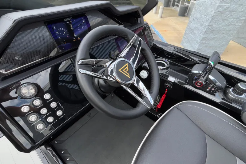 Slide: The Image of 2026 Viaggio D28UW A-T boat dashboard with steering wheel and control panel. - 21