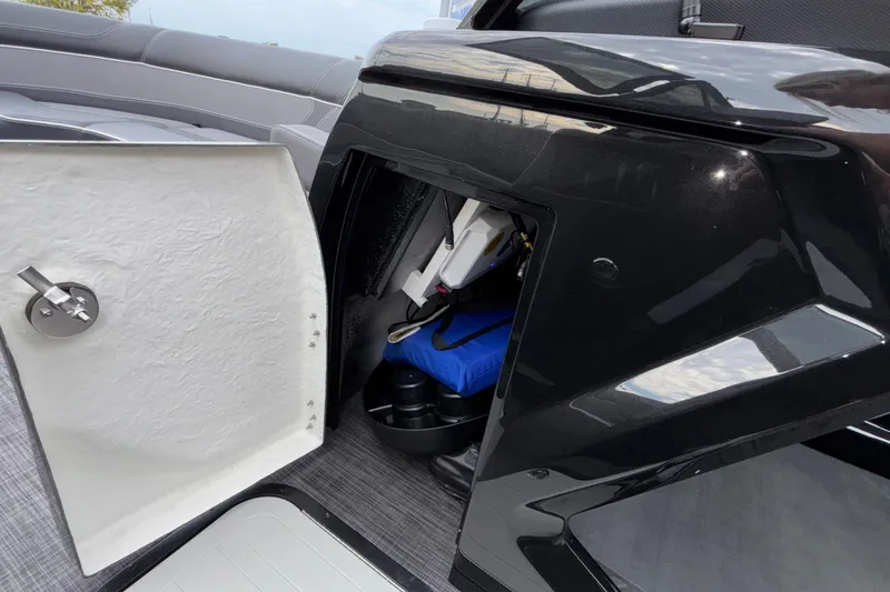 Slide: The Image of Open storage compartment on Viaggio D28UW A-T boat, showcasing interior details and equipment. - 37
