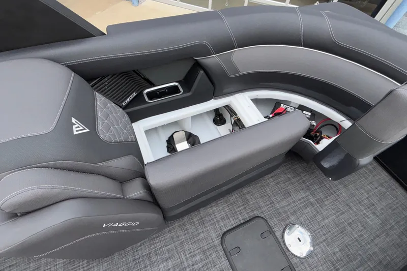 Slide: The Image of 2026 Viaggio D28UW A-T boat interior with open storage compartments and sleek seating design. - 40