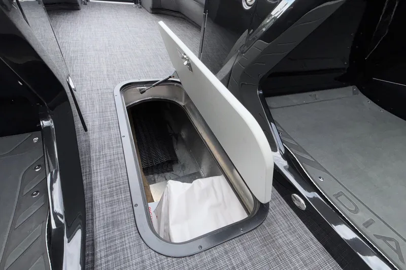 Slide: The Image of 2026 Viaggio D28UW A-T boat interior with open storage compartment on carpeted floor. - 43