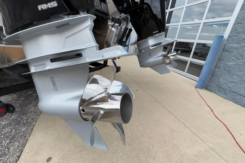 Slide: The Image of 2026 Viaggio D28UW A-T boat engines with Mercury propellers, displayed outdoors. - 47