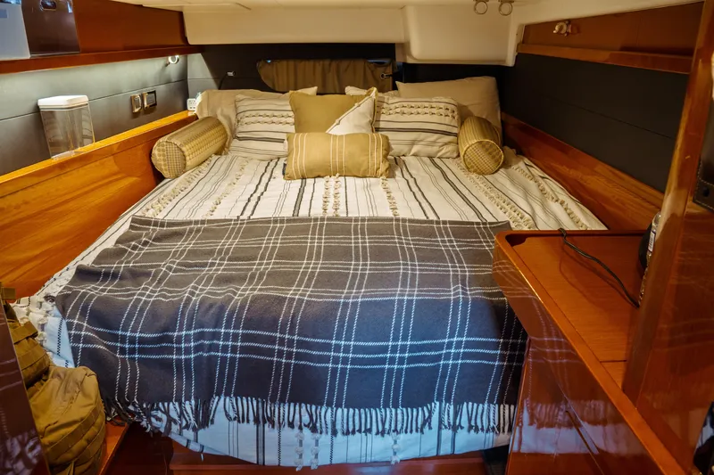 Slide: The Image of Luxurious cabin interior of 2016 Beneteau Oceanis 60 yacht with cozy bedding. - 14