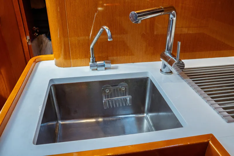 Slide: The Image of Stainless steel sink and faucet in 2016 Beneteau Oceanis 60 yacht kitchen. - 19