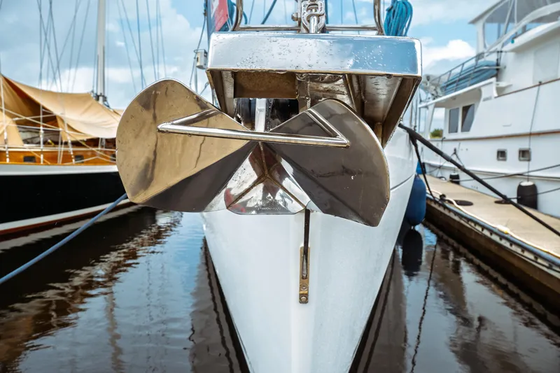 Slide: The Image of Bow view of 2016 Beneteau Oceanis 60 yacht with anchor in marina. - 2