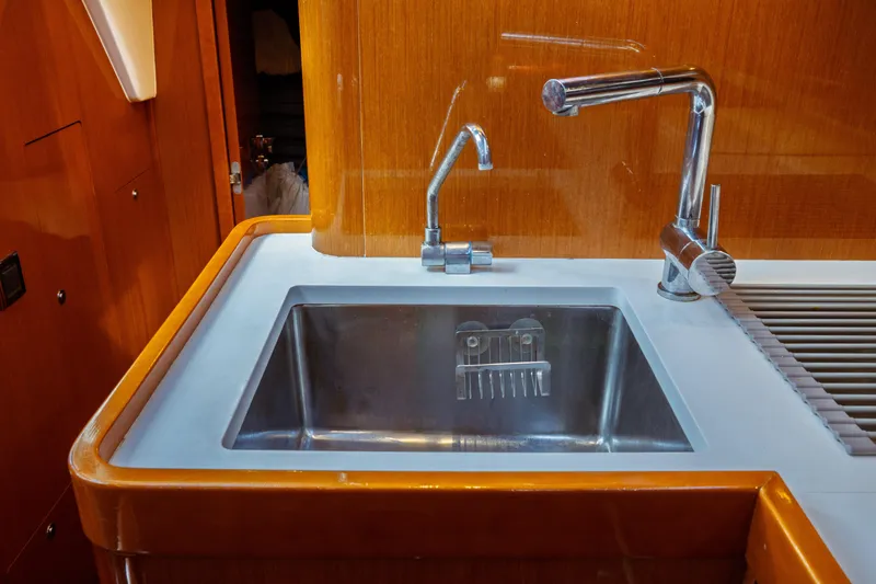 Slide: The Image of Galley sink in 2016 Beneteau Oceanis 60 yacht with modern fixtures. - 20