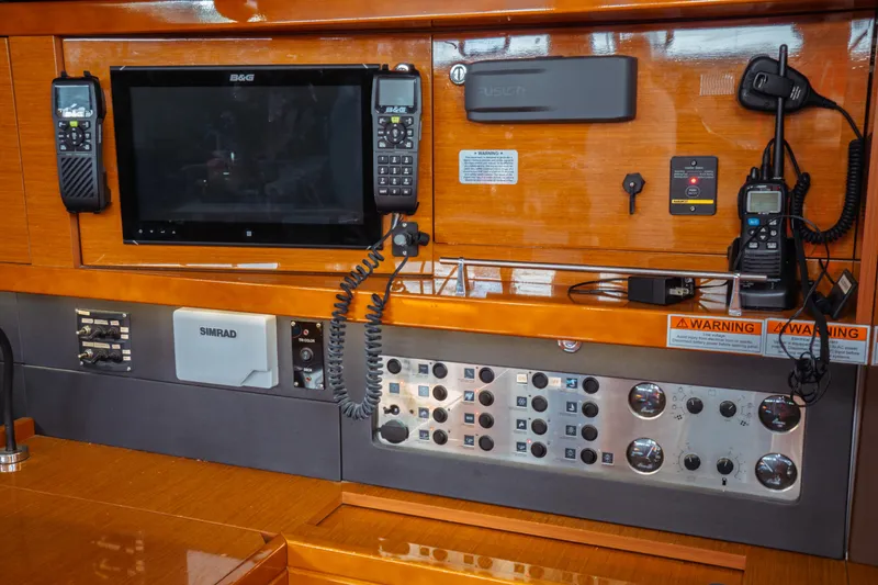 Slide: The Image of Control panel of 2016 Beneteau Oceanis 60 yacht with navigation and communication equipment. - 31