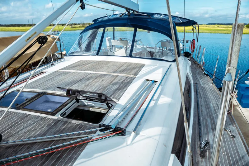 Slide: The Image of 2016 Beneteau Oceanis 60 yacht docked, showcasing sleek deck design and spacious cockpit. - 38