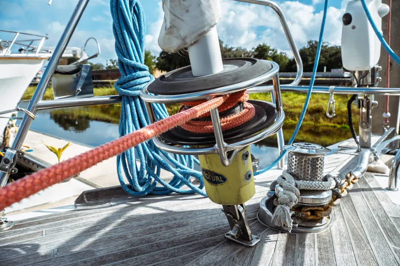 Slide: The Image of Close-up of Beneteau Oceanis 60 sailboat deck equipment, featuring ropes and winch, 2016 model. - 43