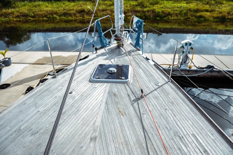 Slide: The Image of Deck of 2016 Beneteau Oceanis 60 yacht docked by a calm river. - 46