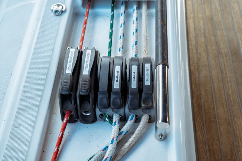 Slide: The Image of Close-up of rope clutches on a 2016 Beneteau Oceanis 60 sailboat. - 56