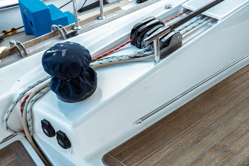 Slide: The Image of Deck view of 2016 Beneteau Oceanis 60 sailboat with winch and ropes. - 57